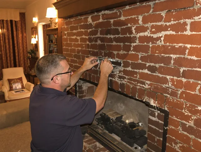 North Tustin Chimney Sweep expert fixing a fireplace in North Tustin, CA